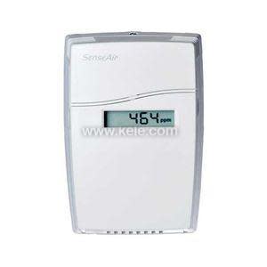 Compact white wall-mounted sensor device labelled SenseAir, with a small digital screen reading carbon dioxide levels.