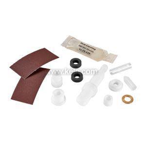 Assorted valve repair parts: white stem, rubber o‑rings, washers, grease packet and sandpaper