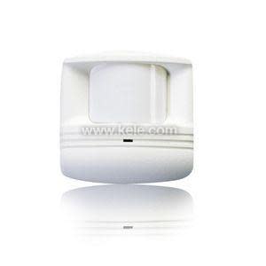 Small white motion detector with rounded lens.