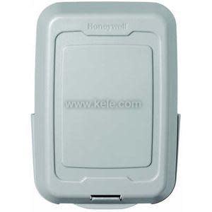 Rectangular light gray plastic box with a hinged front panel used as an outdoor temperature sensor housing.