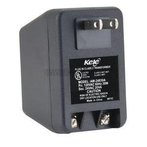 Dark grey plug-in transformer with two flat prongs and black label reading 'Model AM-24830A.'
