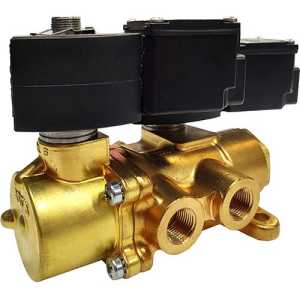 A brass industrial valve featuring two black rectangular solenoid coils mounted on top and multiple threaded ports on the front.