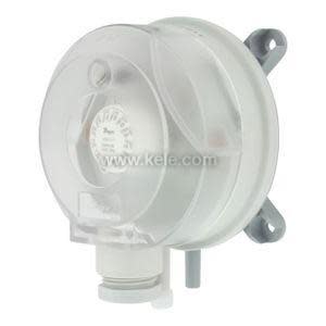 Circular translucent pressure switch with adjustable scale inside and two mounting tabs on the side