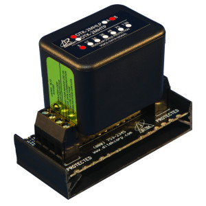 Black surge protector module with green label.
