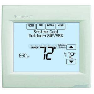 Light green thermostat with wide LCD screen showing indoor temperature 72°F and system controls