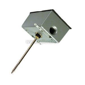Rectangular metal box with side knockout and an extended slender rod projecting outward.