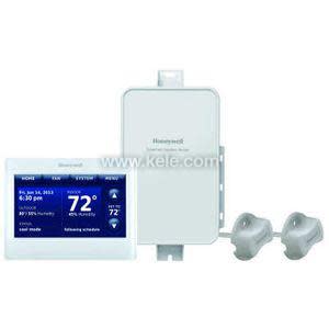 White color touchscreen thermostat display reading 72°, paired with a rectangular control module and two grey clamp-on sensors.