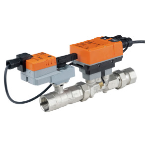 Industrial valve assembly with two orange electronic actuator boxes mounted on a metallic pipe with threaded ends; wires connect to the modules.