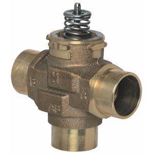 A cross‑shaped bronze control valve with three smooth cylindrical ports and a spring‑loaded stem protruding from the top