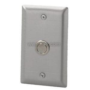 A metal wall plate with a small round push button in the center and two screws at the top and bottom.