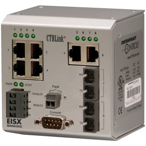 Silver industrial network switch with rows of ports, green indicator lights, a console connector and fiber modules