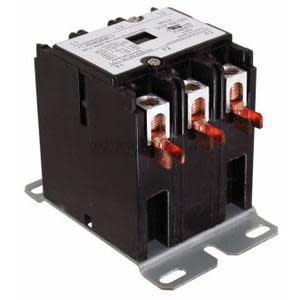 Large black block with multiple copper screw terminals and spade connectors at one end.