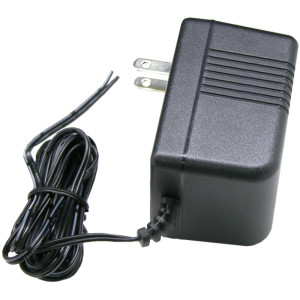 Small black rectangular transformer with prongs and screw terminals on top