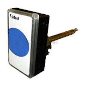 Black rectangular housing with clear front panel featuring a blue circle and long gold-coloured rod extending from the side