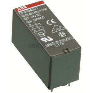 A small dark green electrical relay block with white labels and two metal pins protruding from the bottom.