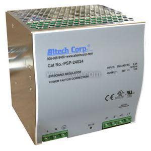 Large square metal power supply with a honeycomb vent top and green connection terminals on the lower corners