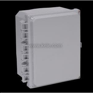 A larger rectangular gray electrical enclosure with a smooth front door and a vertical row of molded cable-entry shapes along the left side, shown on a dark background.