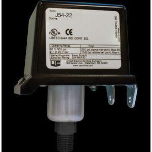 Rectangular black switch housing with white label, mounting bracket and cylindrical threaded sensor stem