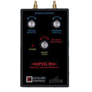 Black handheld device with knobs and brass hose ports for pressure or vacuum.