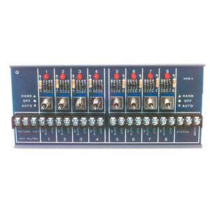 Green circuit board mounted on yellow plate with eight small toggles and indicator LEDs.