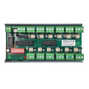 Rectangular green circuit board populated with multiple small relays, terminal blocks, DIP switch array and electronic components