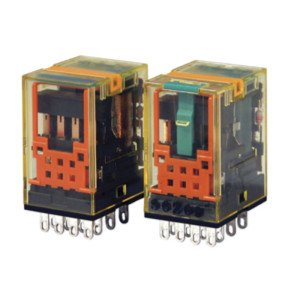 Two transparent rectangular relays showing orange and black internal parts with metal pins on the bottom