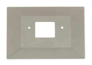 Beige rectangular beveled wall plate with a central rectangular opening and two screw holes for mounting.