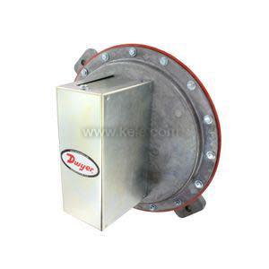 Large circular metal diaphragm with a red rubber ring and an attached brushed metal box labeled Dwyer on the side.