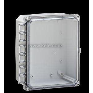 A gray electrical box with a clear front cover secured by corner screws and a row of rectangular protrusions on the side, photographed against a black background.