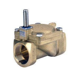 Close-up of a bronze valve body with a vertical silver stem and a large threaded port on the front, seen on white.