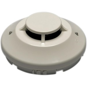 Circular off-white smoke detector device with a central raised disc and small indicator lights around the perimeter