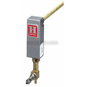 Photo of a slender brass rod attached to a small gray rectangular head featuring a red 'H' emblem, with a brass adjustable valve fitting at the bottom.