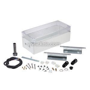 Kit containing a grey box with clear lid, wiring harness, mounting plates and screws