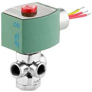 A small industrial solenoid valve featuring a square green coil with a red button on top and a shiny three‑port metal body, with yellow, red, and white wires extending from the back.