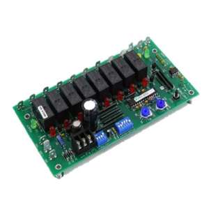 Green board with eight black relays, DIP switches and connectors
