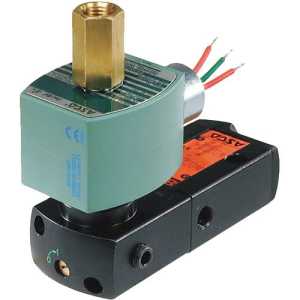 Close-up of an electrically actuated spool valve: a green rectangular coil connected to a black block-shaped valve body with multiple ports, and three colored wires extending from the coil.