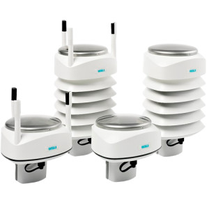 Four small white cylindrical sensors with stacked plates and short cable tails for weather measurements