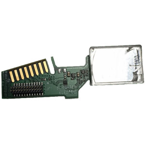 Small green circuit board with gold contacts and an attached silver rectangular module.
