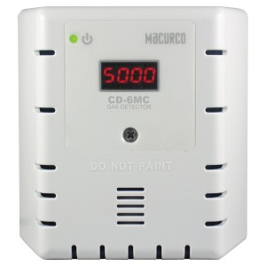 Compact white gas detector labelled CD-6MC, showing a red LED display of 5000 and vent slots on the sides.