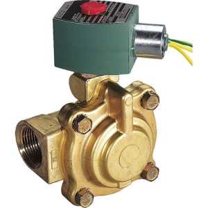 A round-bodied brass valve with four bolts and a side threaded port, topped by a green solenoid actuator with a red button and yellow wires.