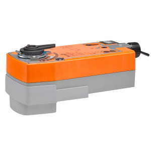 Rectangular orange and grey actuator with round rotary coupling on top and black cable gland at one end.