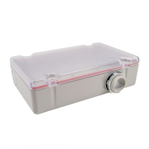Shallow gray box with clear lid, red seal, and side cable fitting