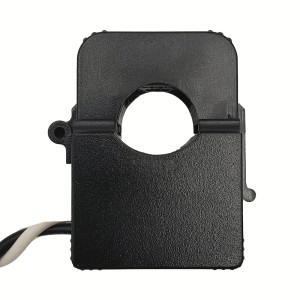 Rectangular black plastic current transformer with a circular aperture in the center and a black-and-white twisted pair of wires extending from the side.