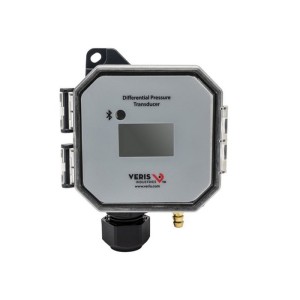 Octagonal grey pressure transducer with small dark LCD window, round indicator and Bluetooth symbol above, plus brass and black port fittings.