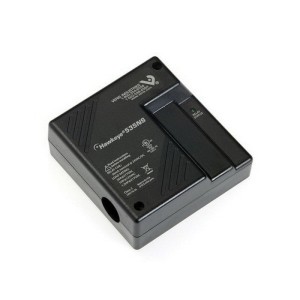 A small square black plastic device with a movable section for clamping around a wire, displaying printed electrical ratings and a small status indicator.