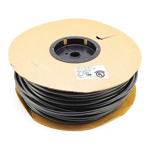 Large spool of coiled black tubing wound around a cardboard reel with central plastic hub.