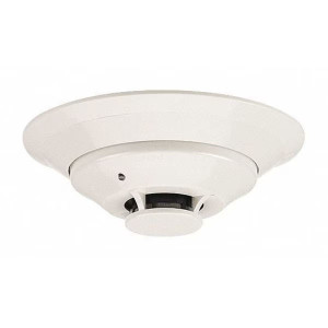 White round smoke detector with central sensor and indicator light