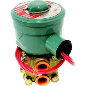 Photo of a compact brass solenoid valve with a round green explosion‑proof coil housing on top, orange plastic plugs in the ports, and red electrical wires extending from the side.