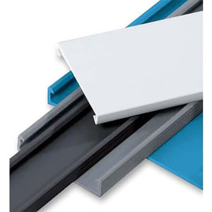 Stack of flat plastic wiring duct covers in different colors (white, gray, black and blue) with clip-on edge profile.