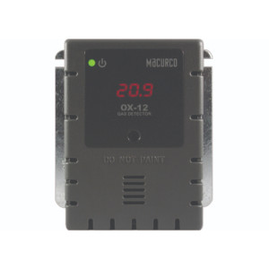 A compact dark gray gas detection unit designed to be mounted on a wall, with a small red numeric display reading 20.9, a green power indicator, and ventilation slots on the lower portion.
